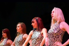 Female dancers in  gold costumes